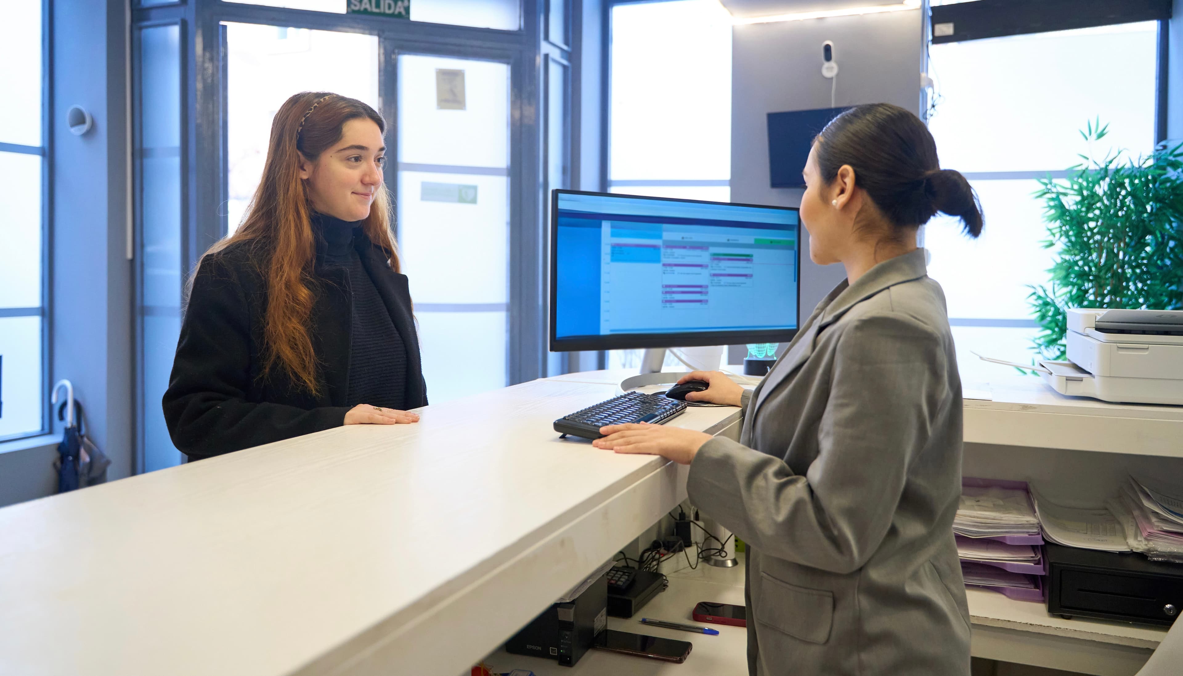 Dental reception desk with insurance eligibility workflow